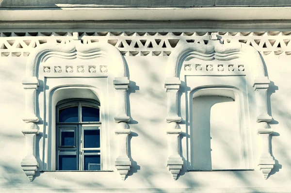 Old decorated windows of traditional Slavic style in belfry of Saint Sophia's cathedral in Veliky Novgorod, Russia.