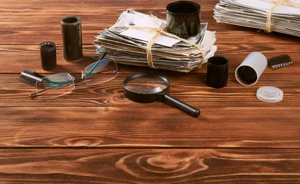 Stack Old Photographs Glasses Magnifying Glass Negatives Wooden Table — Stock Photo, Image