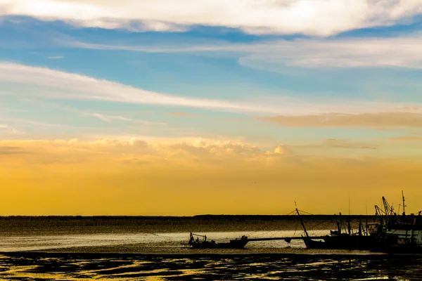 Silhouette fishing boat.