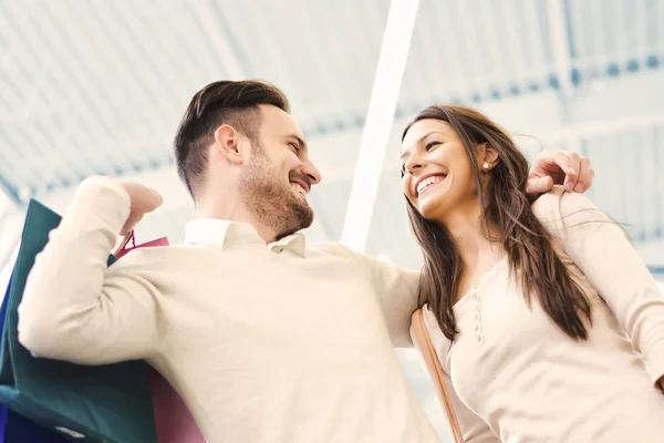 Happy couple in shopping — Stock Photo, Image