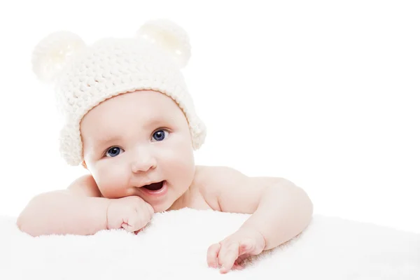 Baby wearing a knit hat with bear ears