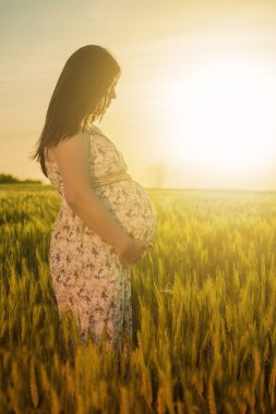 Pregnant woman in nature clipart
