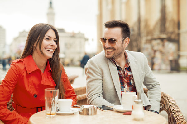 Happy couple enjoying in cafe 