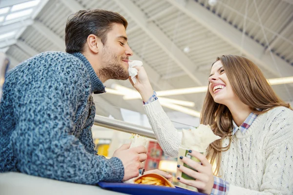 Couple having fun in fast food restaurant — Stock Photo, Image