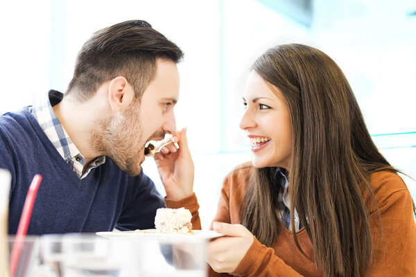 Couple eating cake