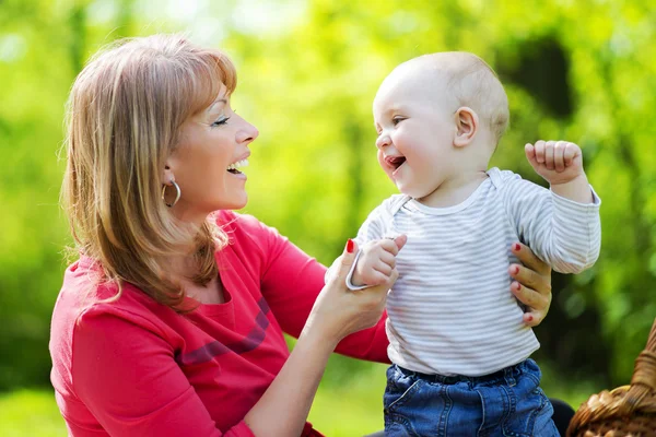 Playful mother having fun with her baby Stock Picture