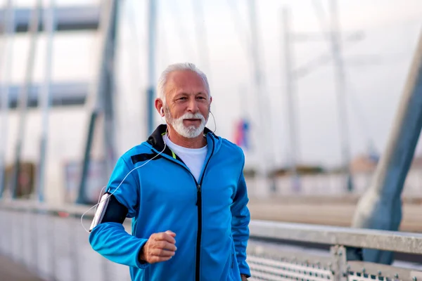 Senior man jogging outdoors.Concept of healthy lifestyle.