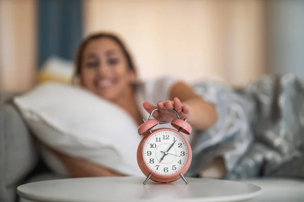 Young Woman Waking Turning Alarm Clock — Stock Photo, Image