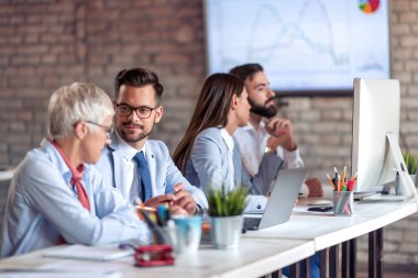 Group of business people working on new project in modern office.