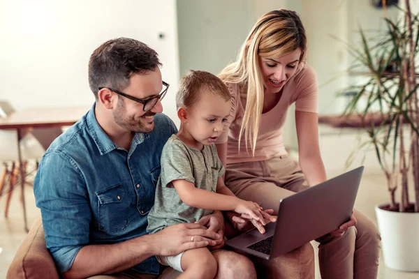 Young Family Looking Cartoon Laptop Together Home — Foto de Stock