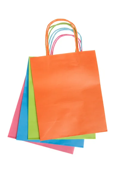 Bolsas de compras de papel de colores aisladas en blanco — Foto de Stock