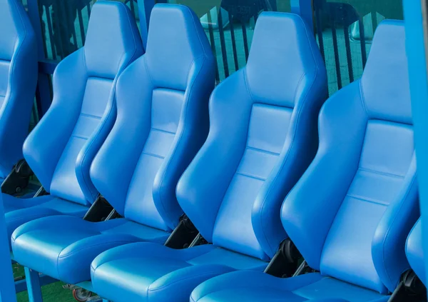 Empty coach and reserves blue bench on a football stadium — Stock Photo, Image