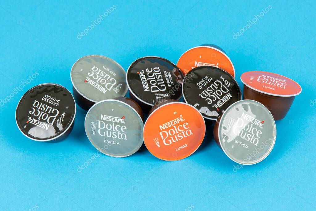 VARNA, BULGARIA - SEPTEMBER 8, 2021: Nescafe Dolce Gusto coffee capsules on blue background.