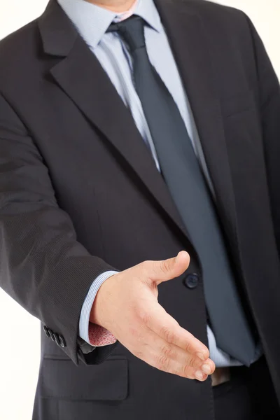 Man in business suit offers his hand to seal a deal — Stock Photo, Image