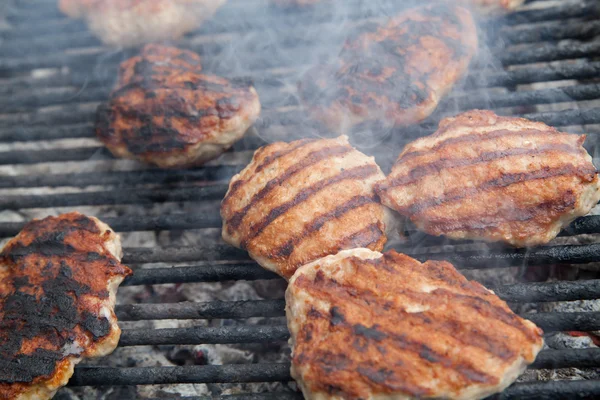 Grilling meat balls on barbecue grill — Stock Photo, Image