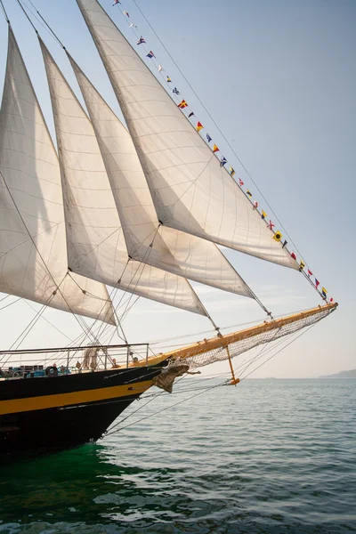 Old ship with white sales, sailing in the sea — Stock Photo, Image