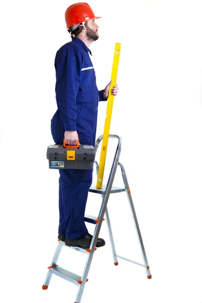 Man werknemer op de ladder — Stockfoto