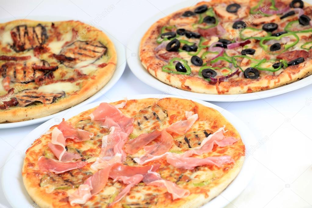 three different kind of pizzas