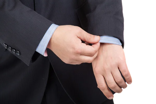 Closeup of a man in suit correcting a sleeve — Stock Photo, Image