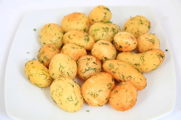 Roasted garlic potatoes — Stock Photo, Image