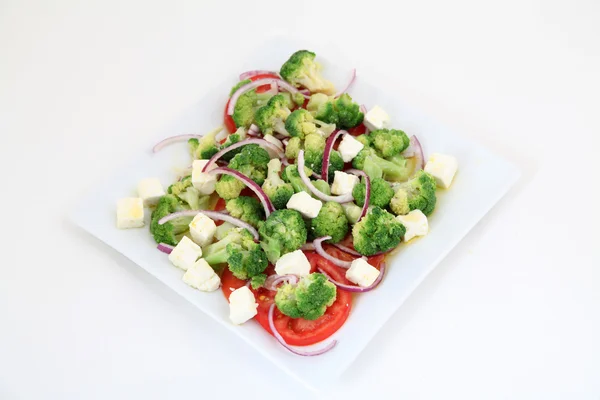 Broccoli salad with tomatoes and cheese — Stock Photo, Image