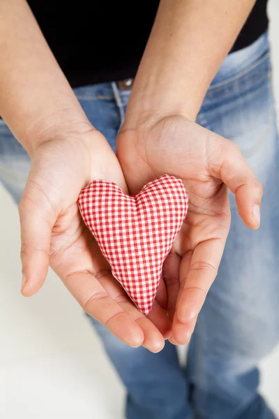 Woman hands holding a heart — Stock Photo, Image