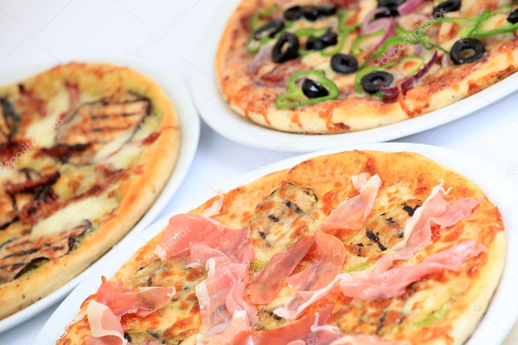 Close-up on freshly baked pizzas