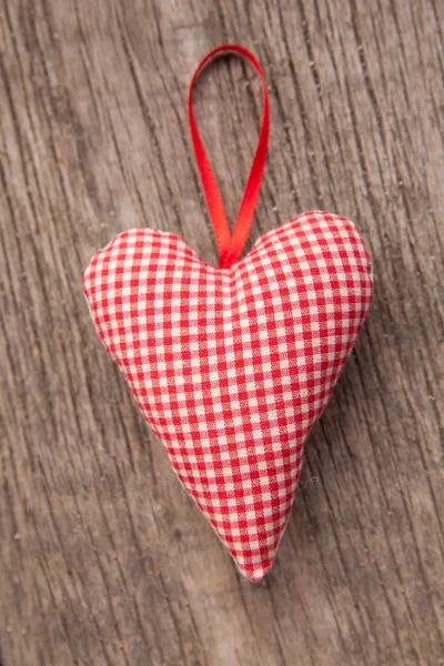 Heart over a wooden background — Stock Photo, Image