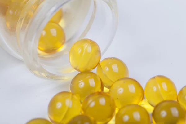 Pastillas de la botella sobre el fondo blanco . — Foto de Stock