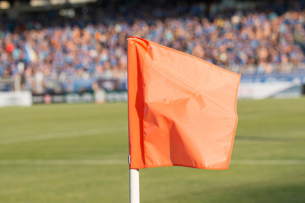 Corner flag on an soccer field during a football mach 