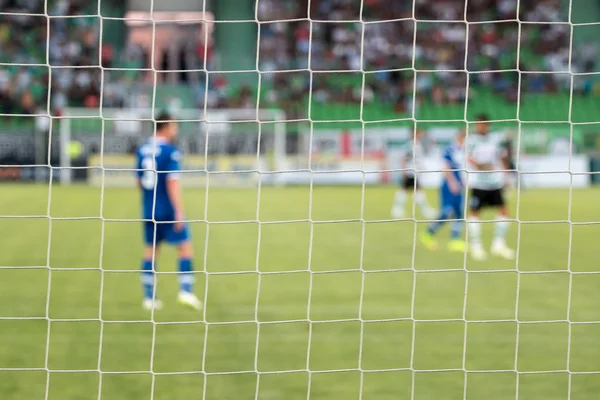 Football net during a football mach. Focus on the net — Stock Photo, Image