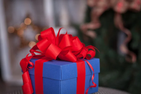 Blue gift box with red ribbon. Christmas theme — Stock Photo, Image