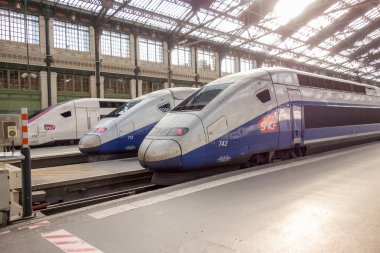 PARIS, FRANCE - APRIL 14, 2015: TGV high speed french train in gare de Lyon station on April 14 , 2015 in Paris, France clipart