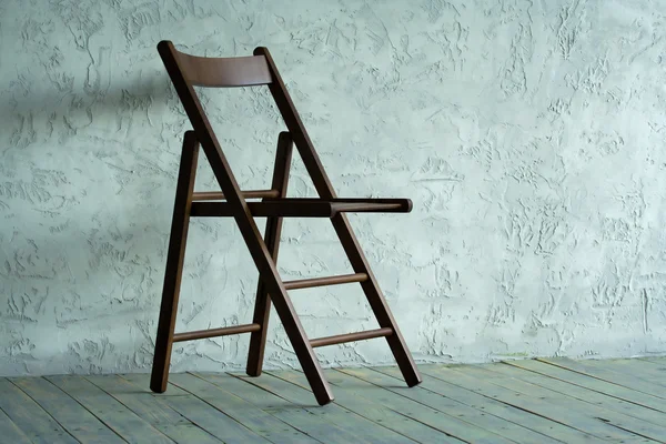 Wooden chair in empty room — Stock Photo, Image