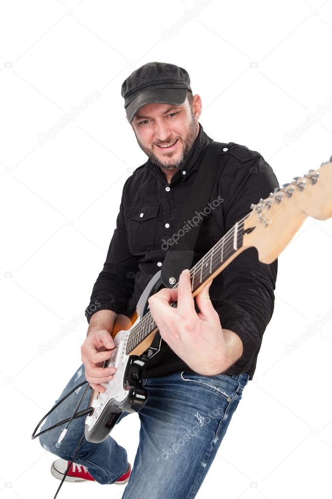 Musician playing electric guitar with enthusiasm. Isolated on white