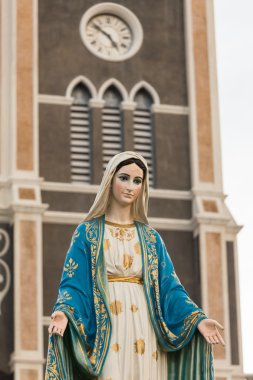 Saint Mary or the Blessed Virgin Mary, the mother of Jesus, in front of the Roman Catholic Diocese or Cathedral of the Immaculate Conception, Chanthaburi, Thailand. clipart
