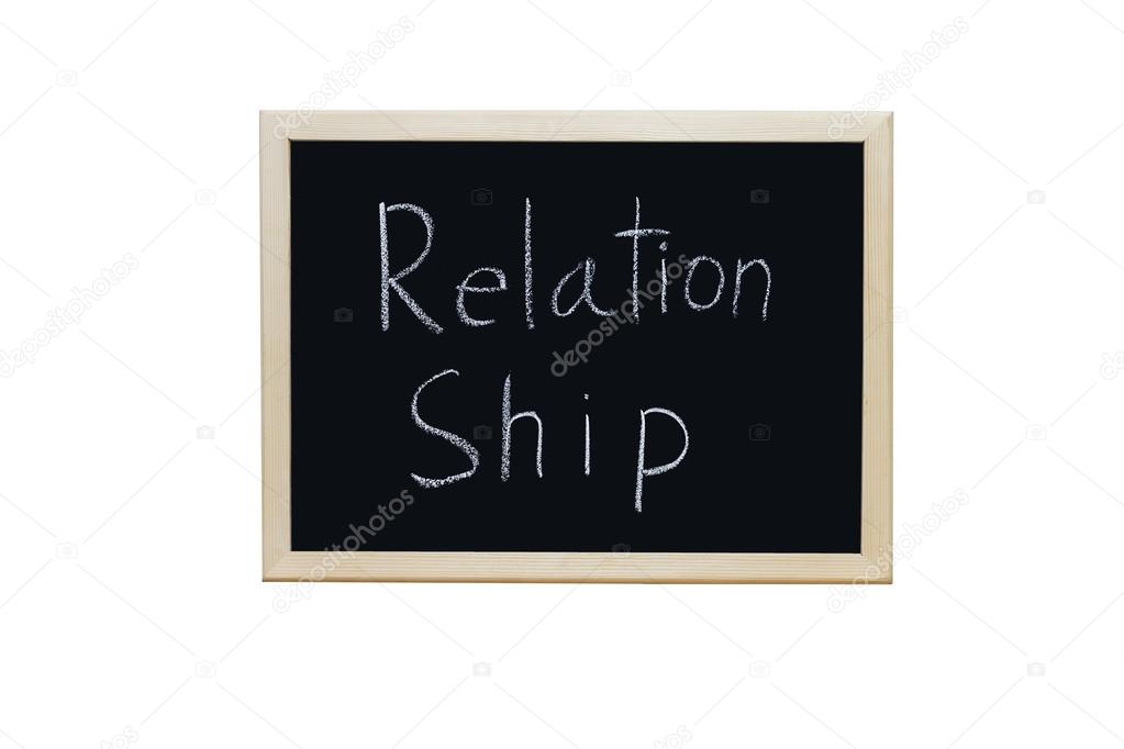 Relationship written with white chalk on blackboard.