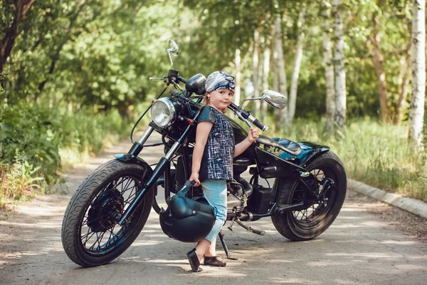 Little girl on a motorcycle. — Stock Photo, Image