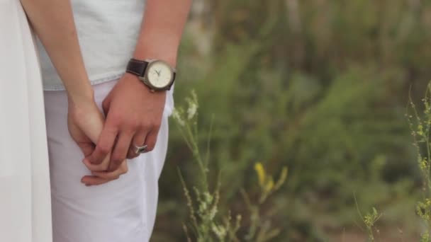 Couple in love holding each others hands. Close-up. — Stock Video