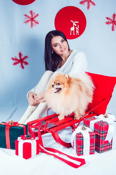 Girl with a Dog on the Background of New Years Decoration. — Stock Photo, Image