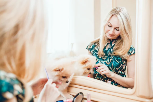 Beautiful Blonde Woman with Her Dog in a Beautiful Interior