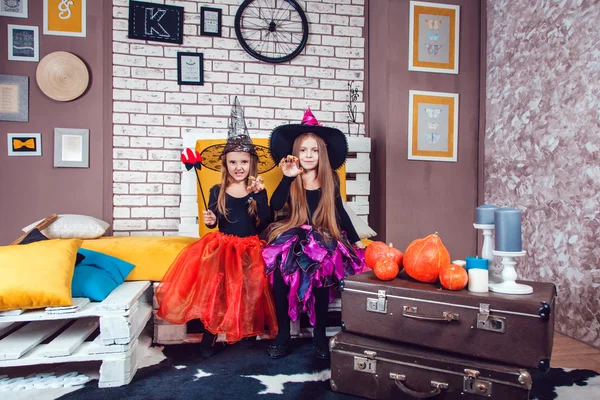 Girls, dressed up in Halloween costumes, show emotions of witches and vampires. — Stock Photo, Image