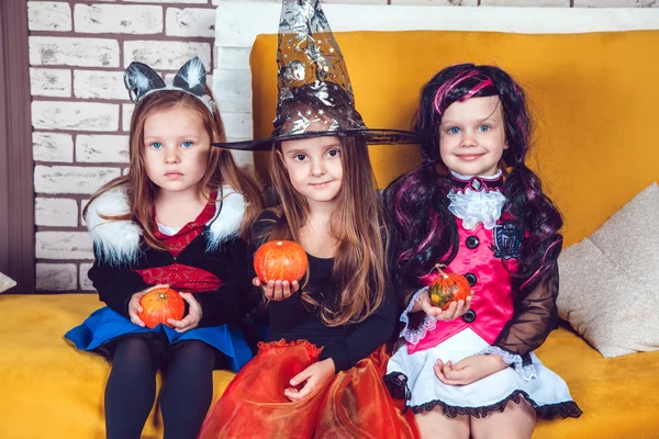 Girls, dressed up in Halloween costumes, show emotions of witches and vampires. — Stockfoto