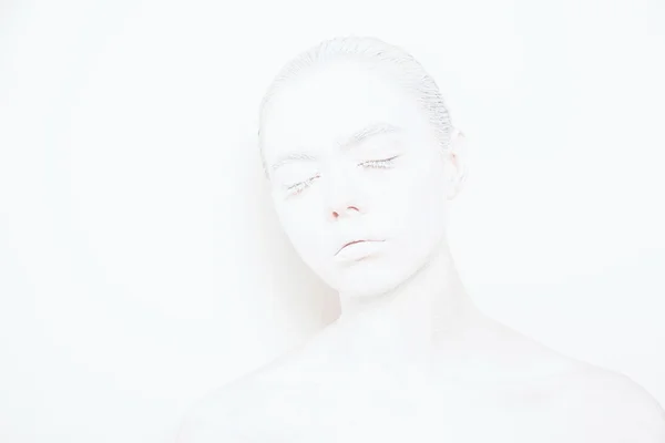 Girl with White Paint on the Skin on a White Background — Stock Photo, Image