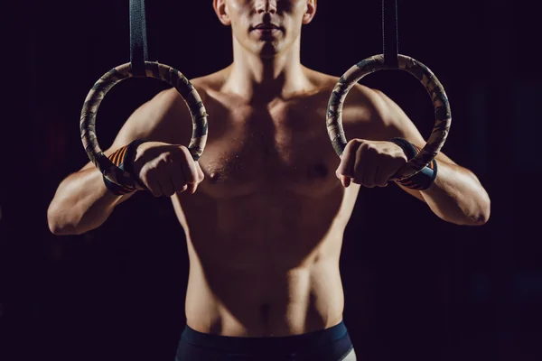 Athlete prepare for exercise on rings — Stock Photo, Image