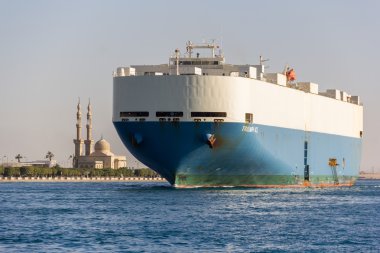 Ship cross a Suez canal. clipart