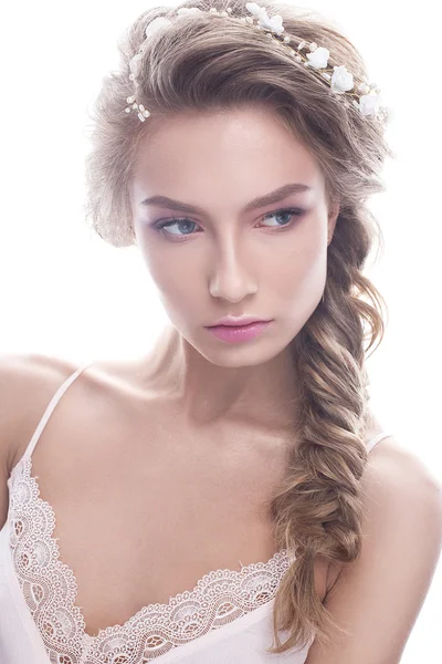 Beautiful girl in image of bride with wreath of flowers on her hair. Beauty face