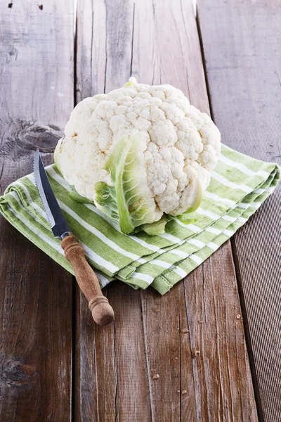 Single cauliflower d on a wooden background — Stock Photo, Image