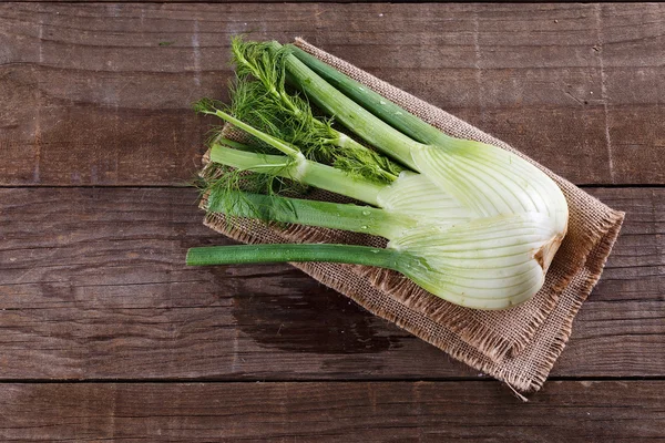 Fennel bulb on rustic wooden background — Stock Photo, Image