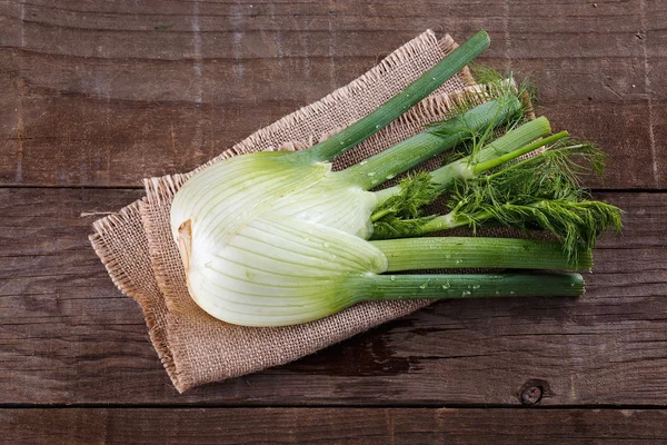 Fennel bulb on rustic wooden background — Stock Photo, Image